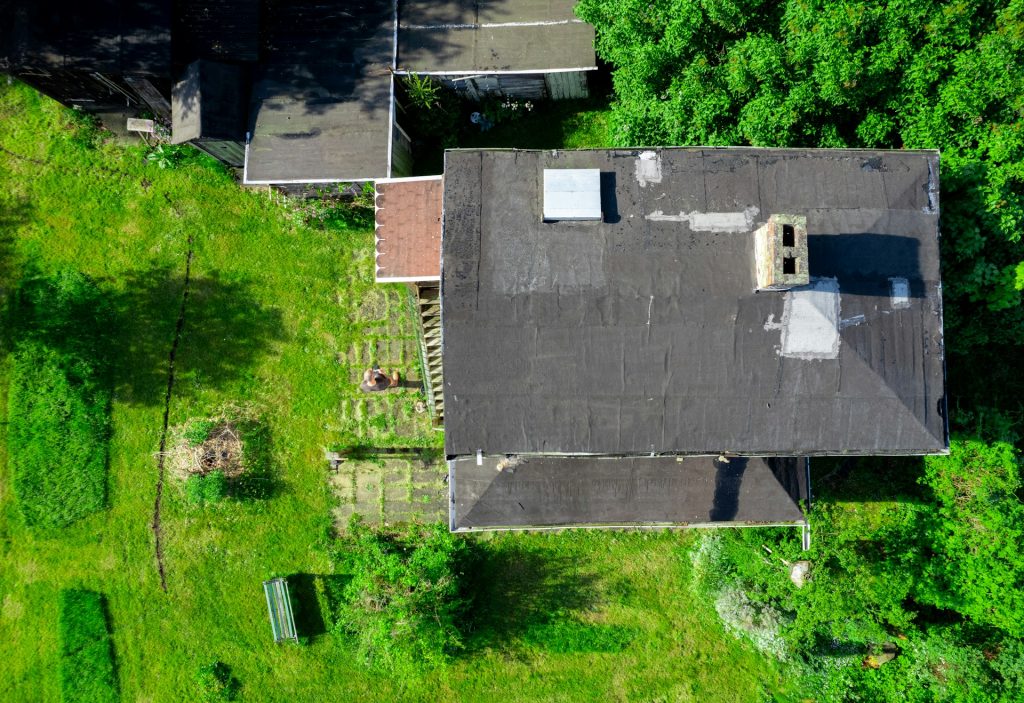 A top-down shot of several roofing problems
