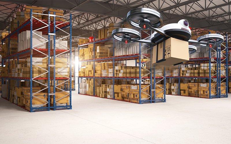 Drone picking and transferring packages in warehouse 