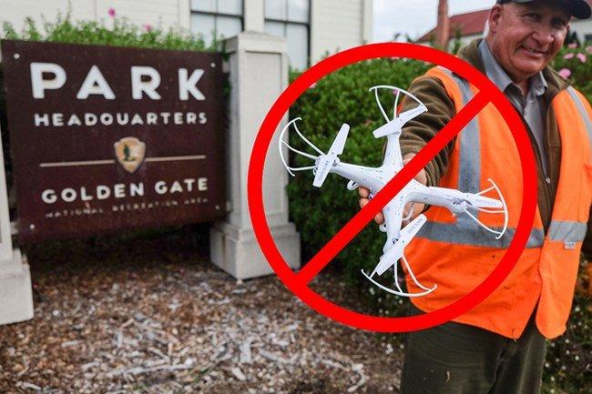 A ranger with a drone in national park.