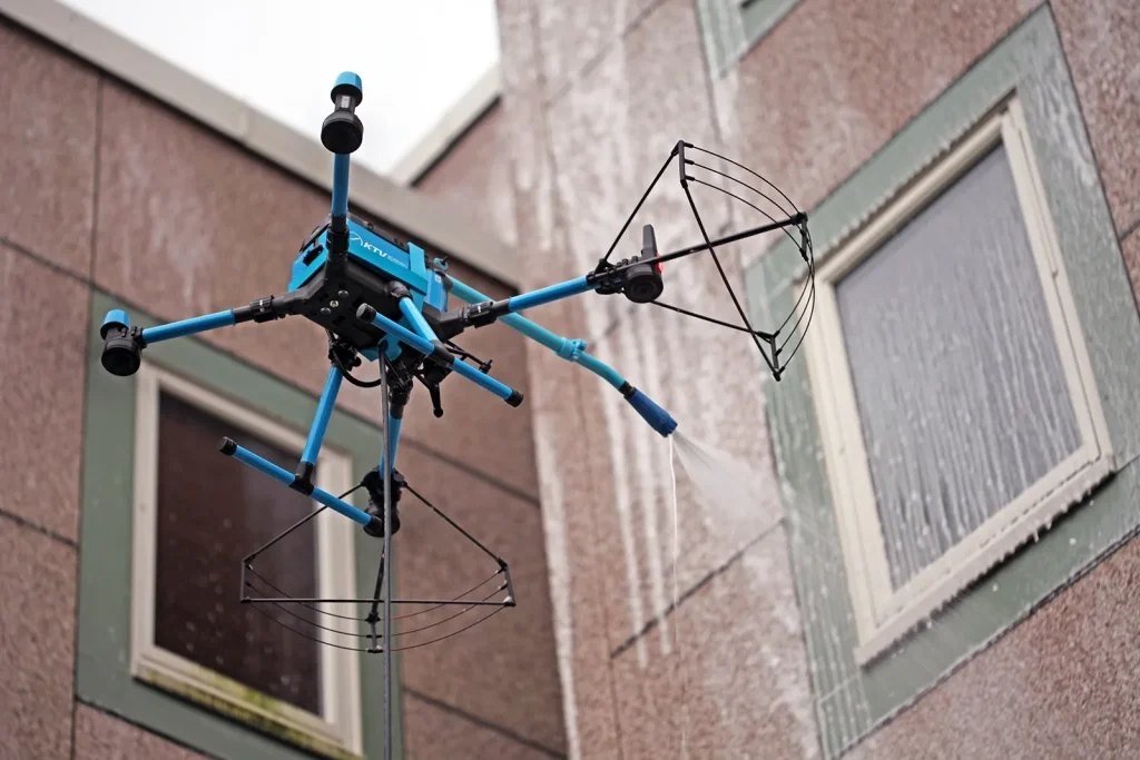 Drone cleaning windows of a scyscraper.